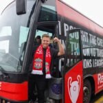 Youtuber-Simon-Wilson-with-the-bus-he-has-hired-to-take-Liverpool-fans-to-Paris-for-the-UCL-final