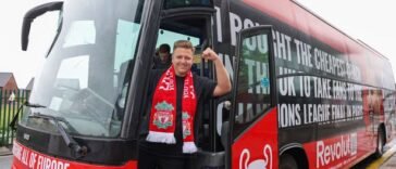 Youtuber-Simon-Wilson-with-the-bus-he-has-hired-to-take-Liverpool-fans-to-Paris-for-the-UCL-final